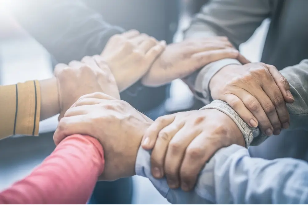 Groups of Denver Therapists holding hands