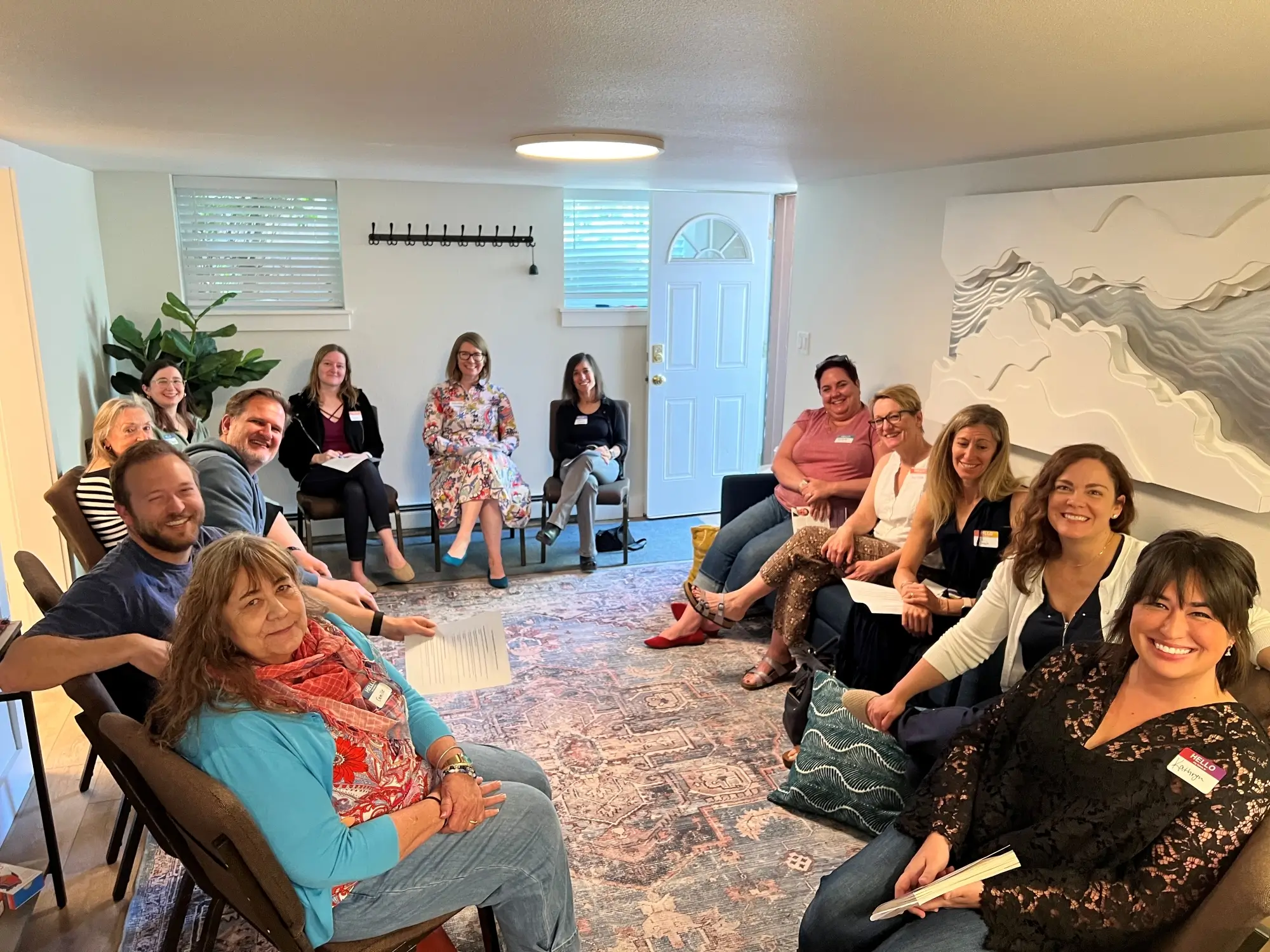 Members of Book Club Therapist Collective sitting in a circle in the Underground at Collaborative Counseling of Colorado