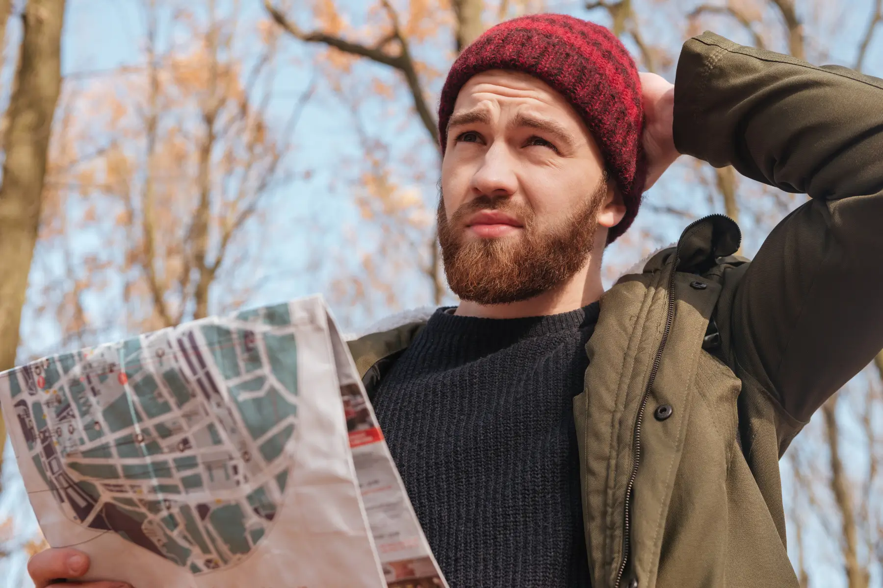 Young man looking confused holding a man